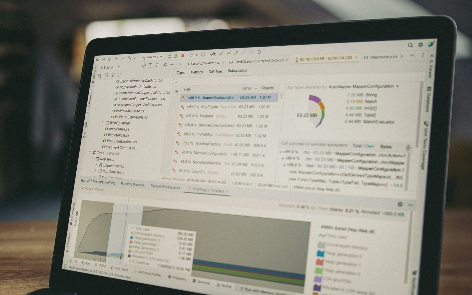 Laptop screen showing memory profiling data with a pie chart and file allocation table