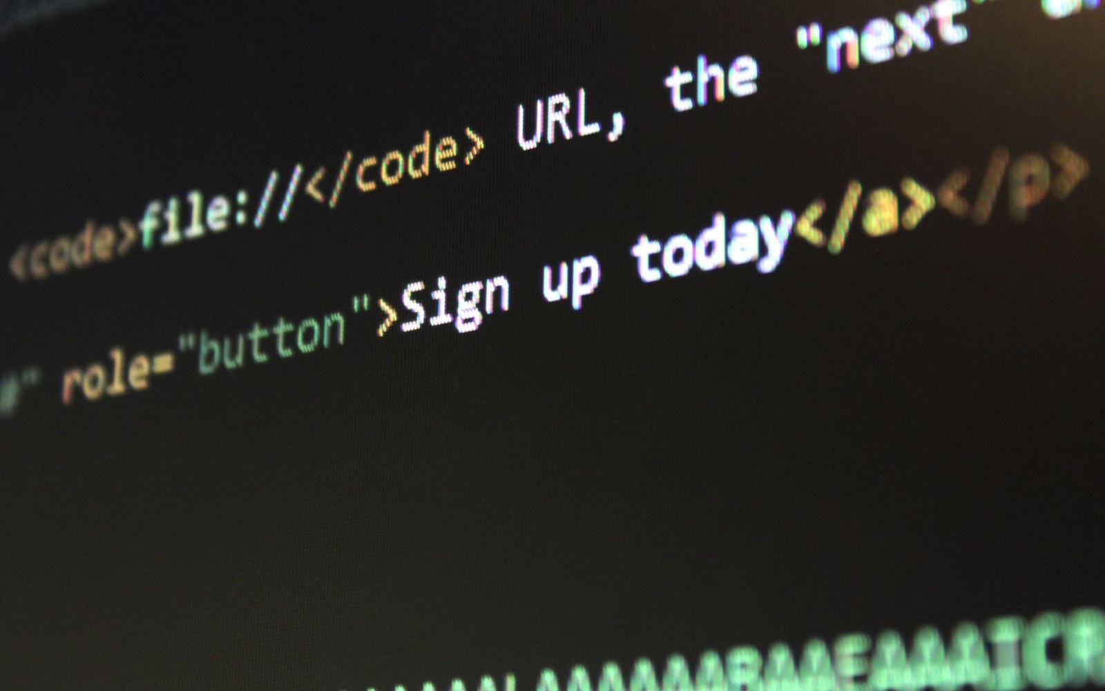 Close-up of HTML code on a screen showing a button link labeled "Sign up today"