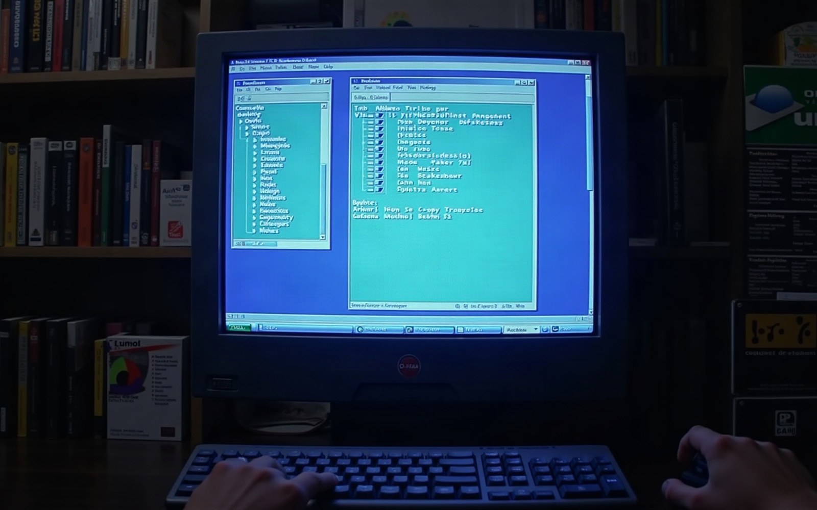 Hands typing on a keyboard in front of a CRT monitor showing an old file manager interface
